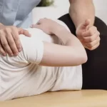 Manual therapy session focusing on spinal alignment and joint mobilization to prevent orthopedic surgery