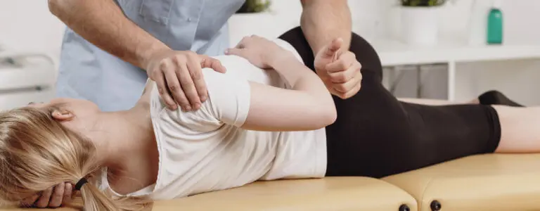 Manual therapy session focusing on spinal alignment and joint mobilization to prevent orthopedic surgery