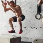 Athletes performing plyometric jump training under physiotherapy supervision to enhance agility and strength